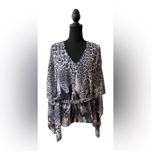 Jennifer Lopez: Animal Print V-Neck Blouse with Dolman Sleeves